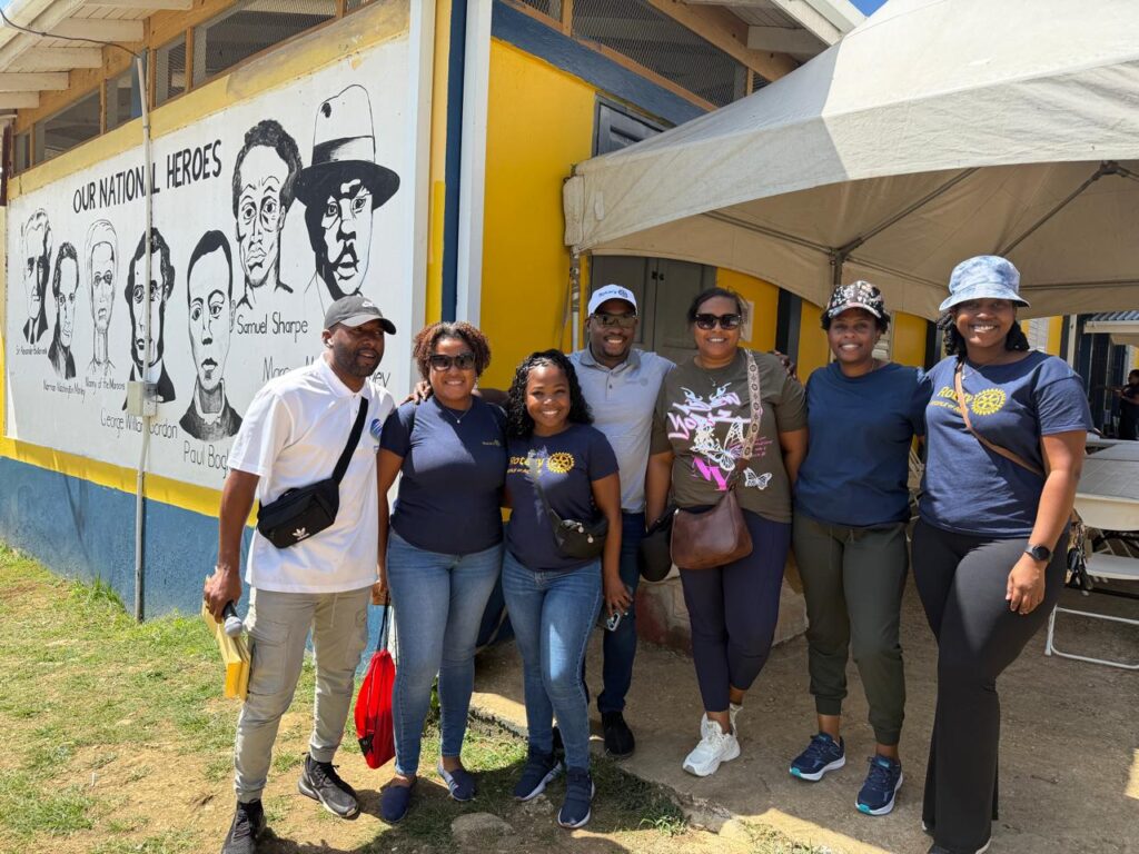 Rotary Club of New Kingston distributing emergency solar chargers.