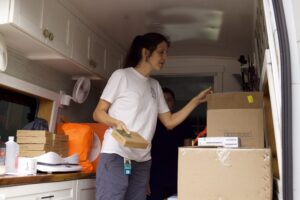 Woman distributes medical supplies