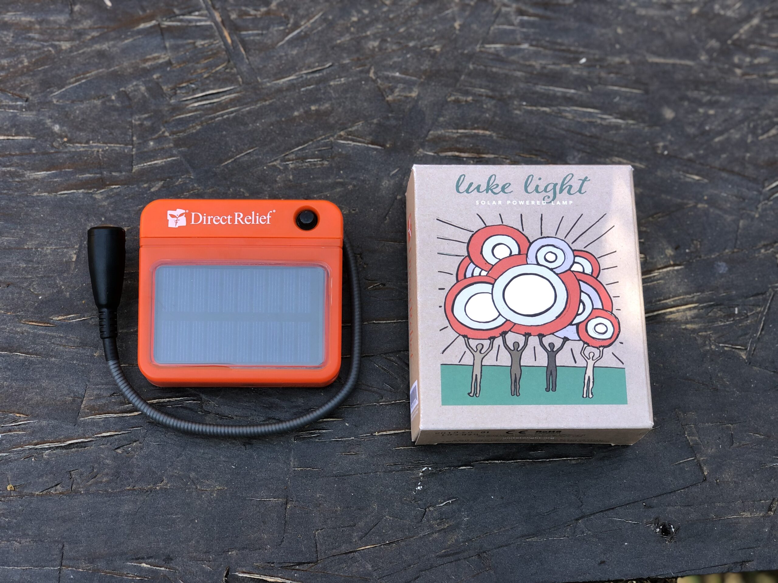 A Direct Relief branded Luke Light with its box