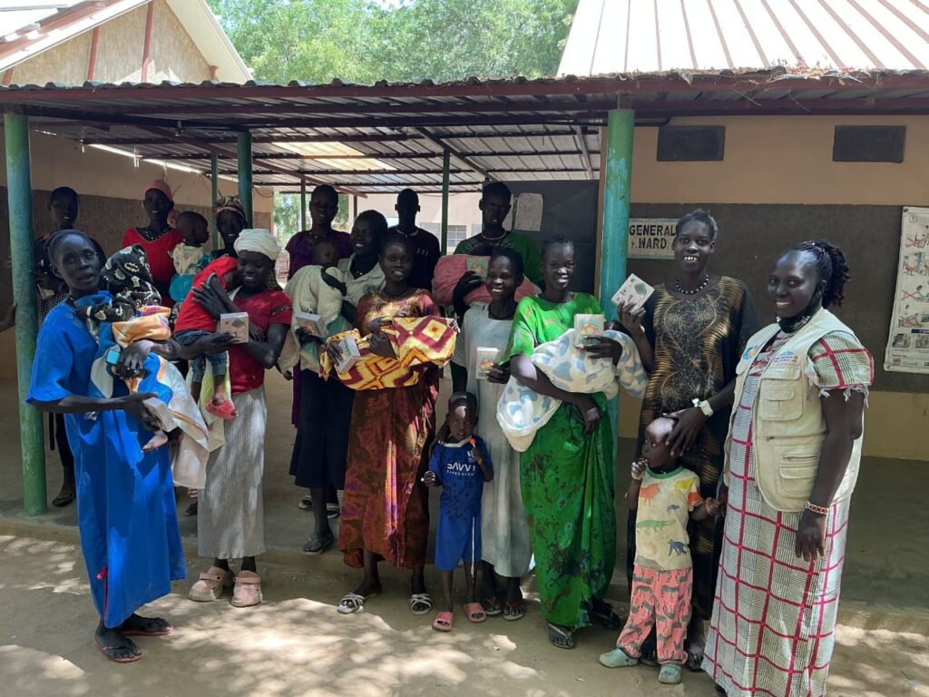Women and Children at a hospital in Sudan, after receiving their solar Lights.